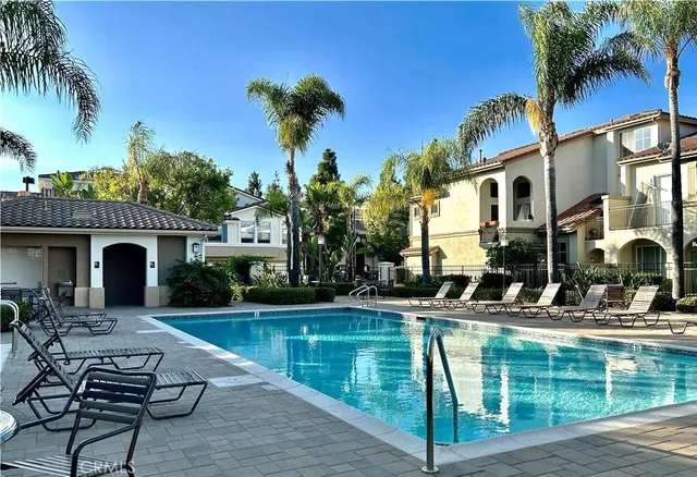 a house with swimming pool in front of it
