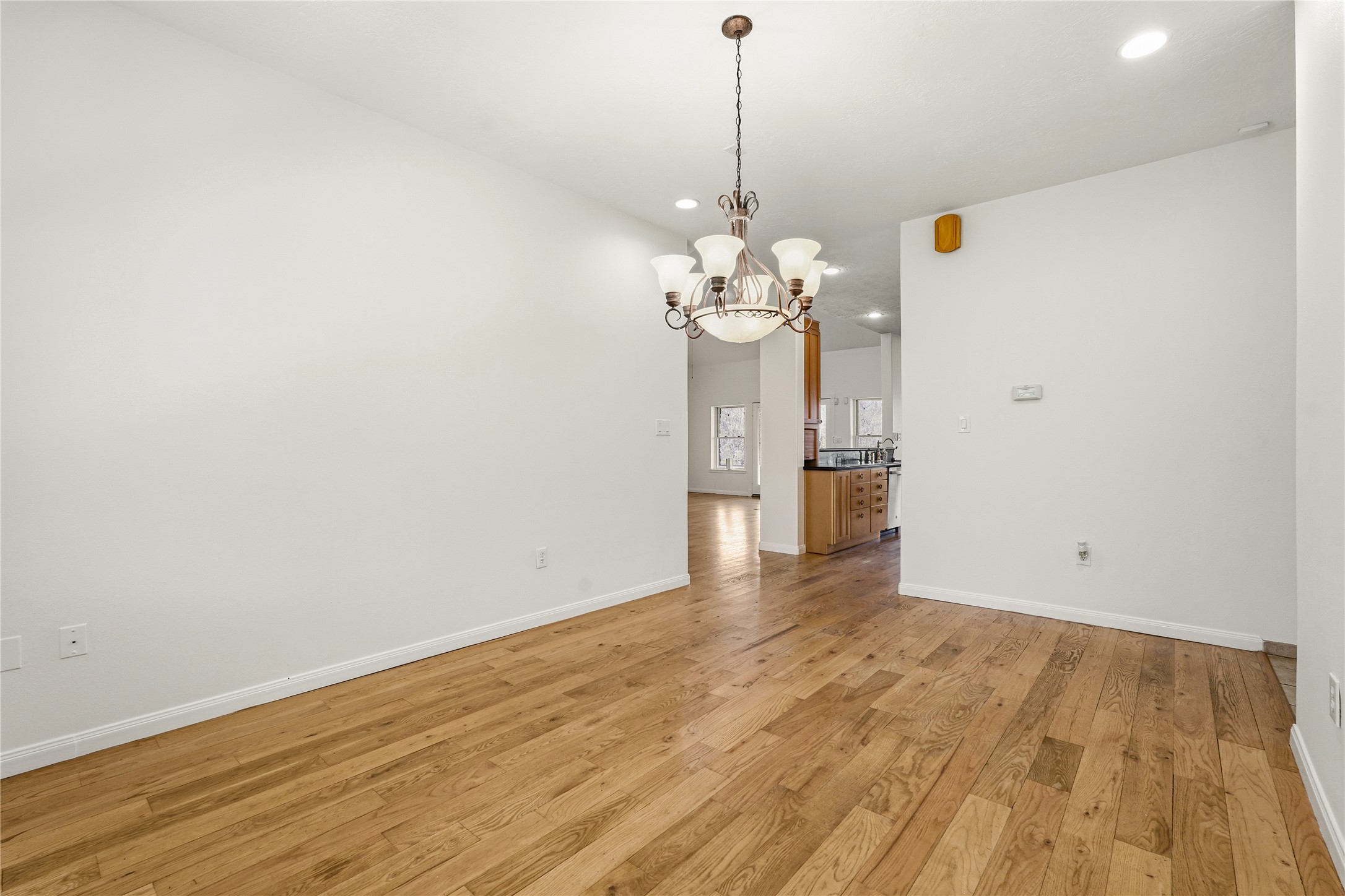 41712 Harpers Church Road Hempstead, TX 77445 - Photo 26 of 50 a view of a room with wooden floor and a chandelier