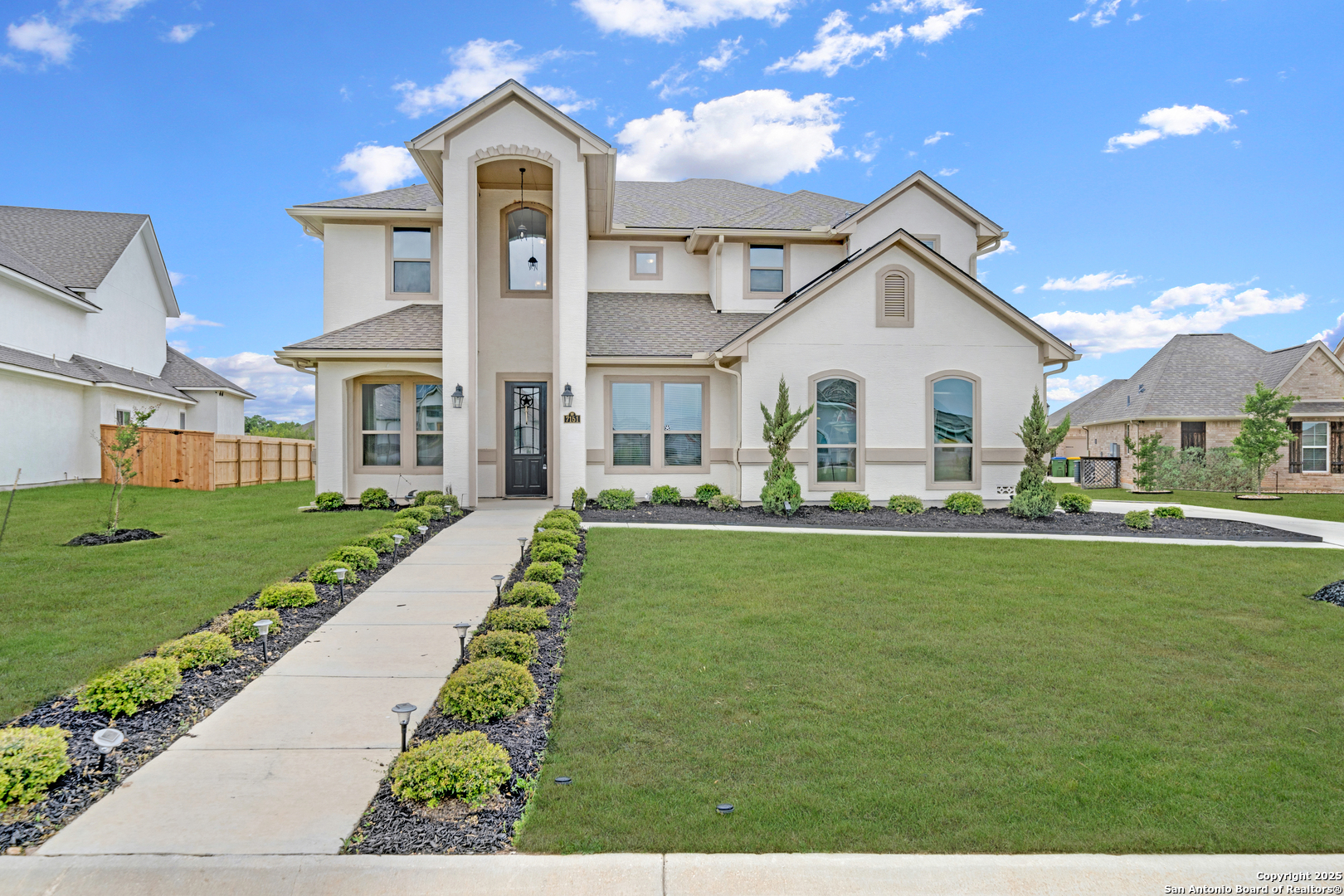 a front view of a house with a yard