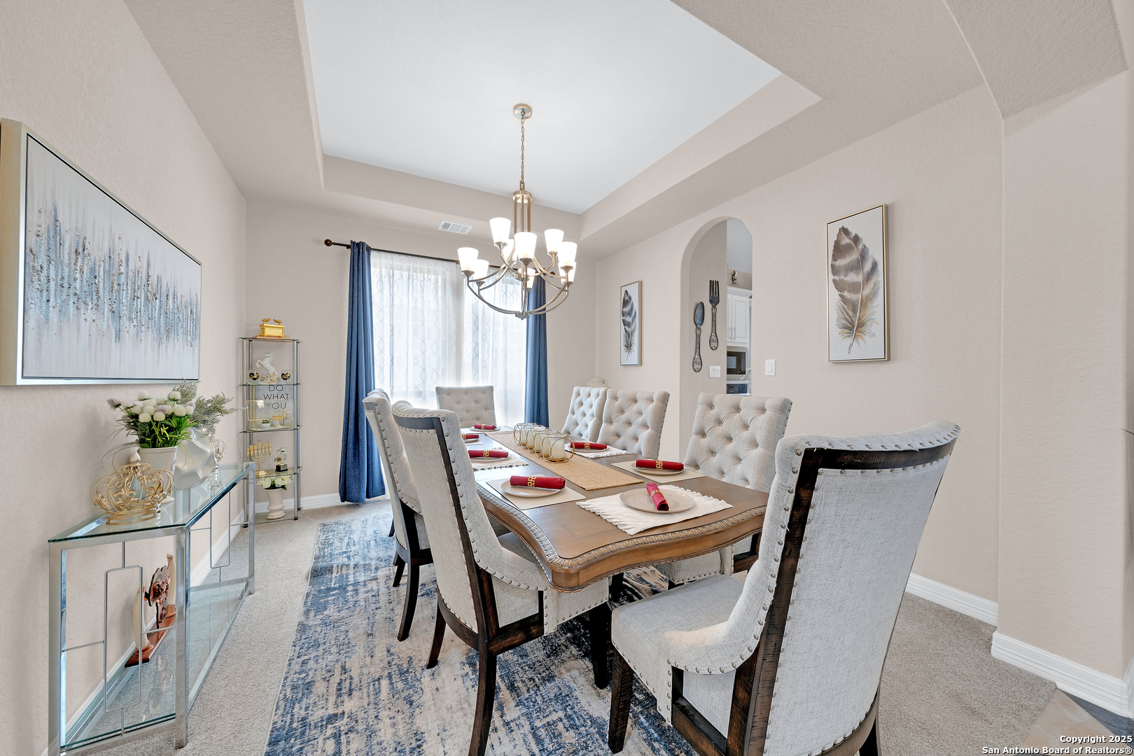 7151 Agarita Mist Fair Oaks Ranch, TX 78015 - Photo 12 of 49 a view of a dining room with furniture and chandelier