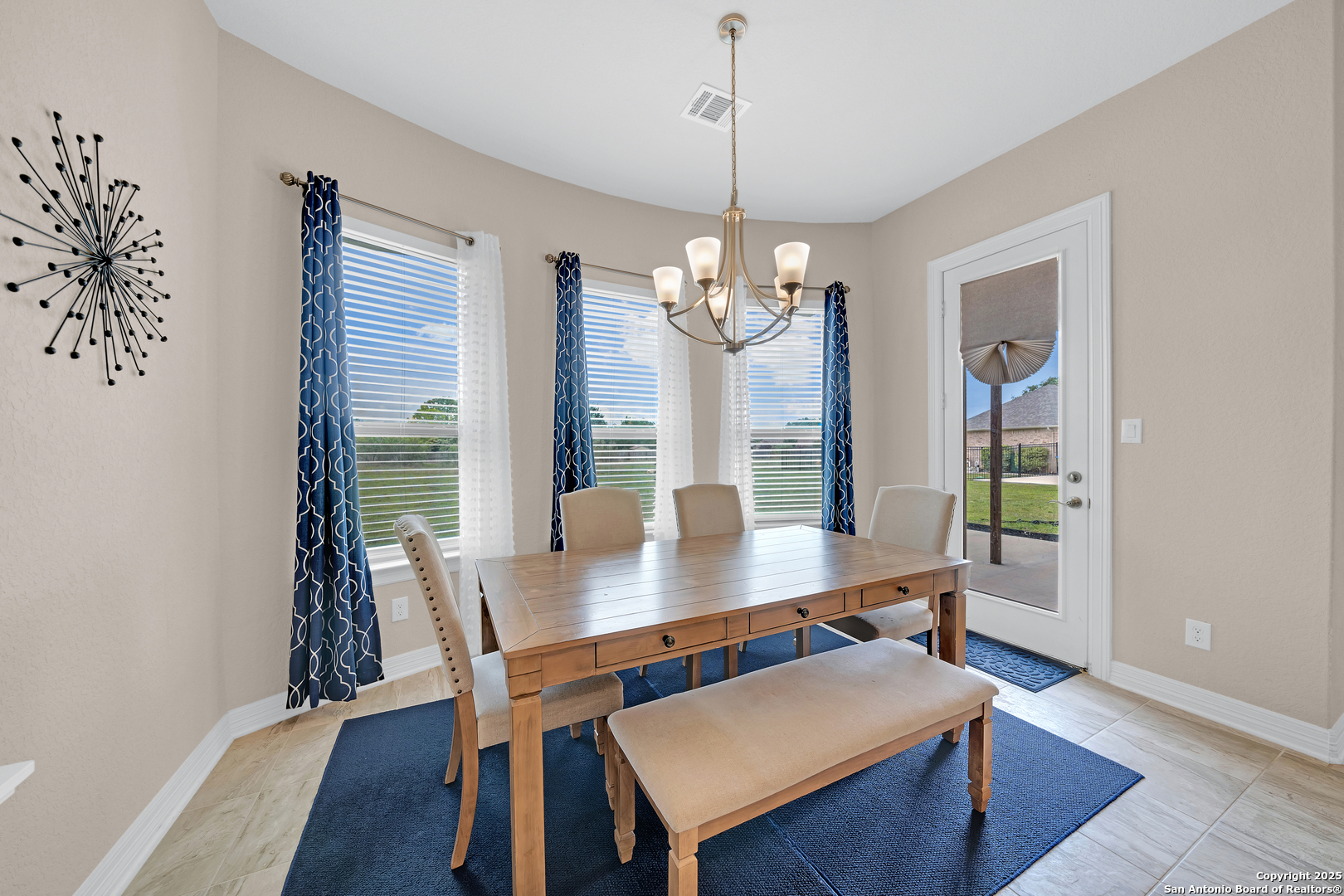 7151 Agarita Mist Fair Oaks Ranch, TX 78015 - Photo 16 of 49 a view of a dining room with furniture window and wooden floor