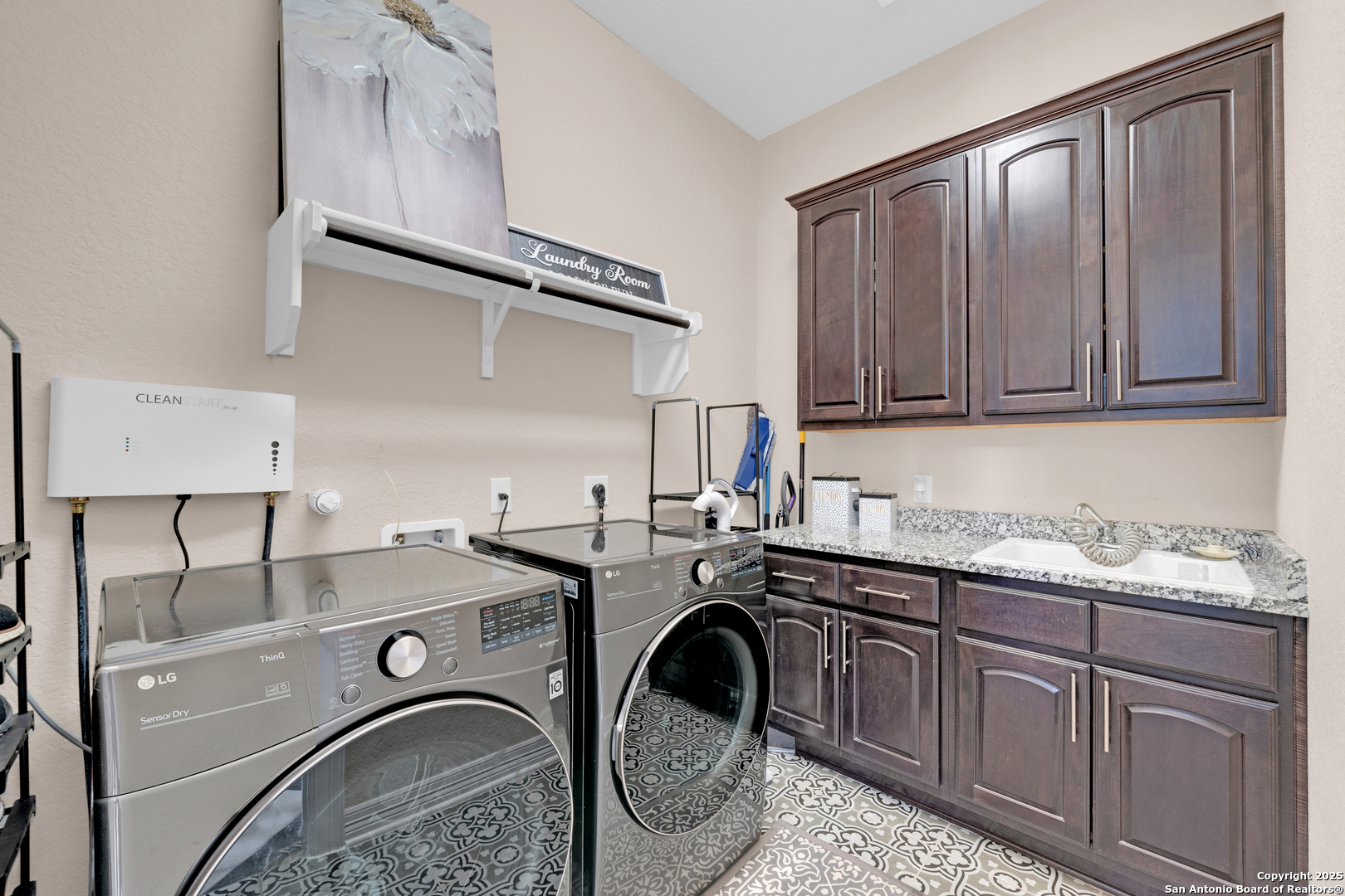 7151 Agarita Mist Fair Oaks Ranch, TX 78015 - Photo 17 of 49 a utility room with dryer and washer