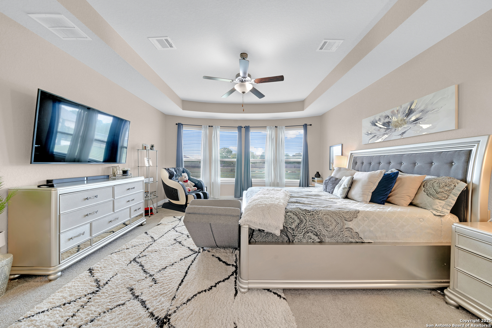 7151 Agarita Mist Fair Oaks Ranch, TX 78015 - Photo 19 of 49 a bedroom with a bed and a flat screen tv