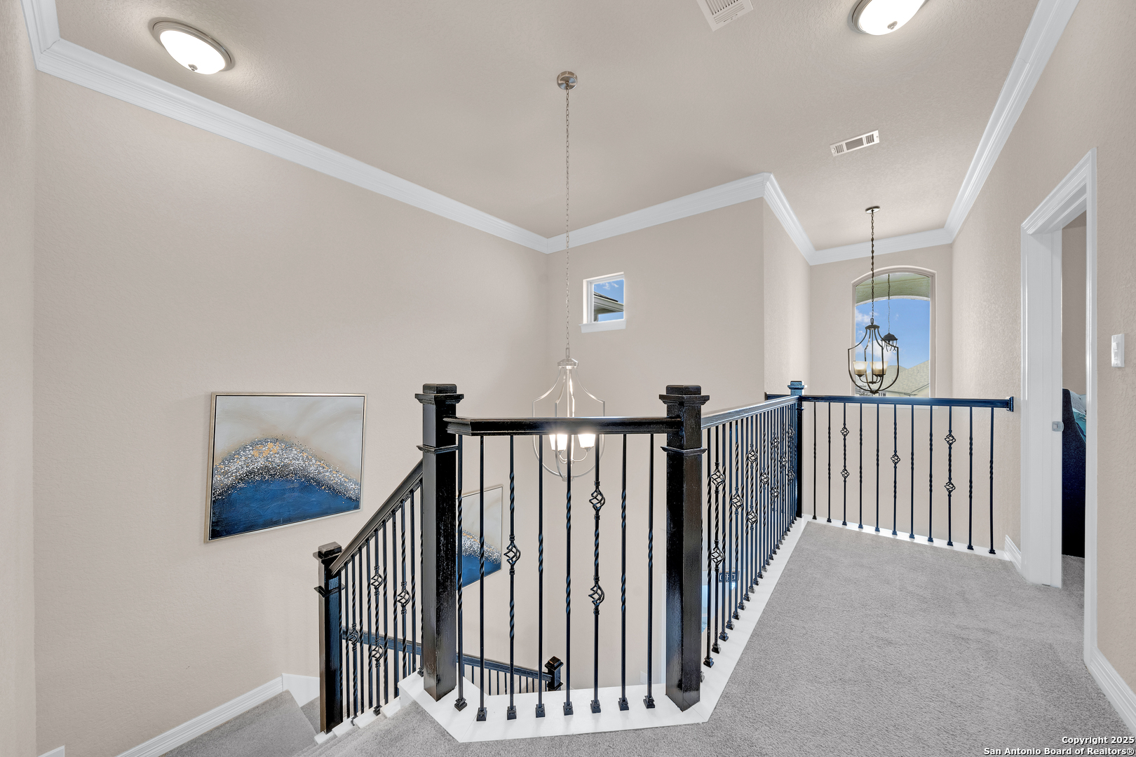 7151 Agarita Mist Fair Oaks Ranch, TX 78015 - Photo 25 of 49 a view of a hallway with windows and stairs
