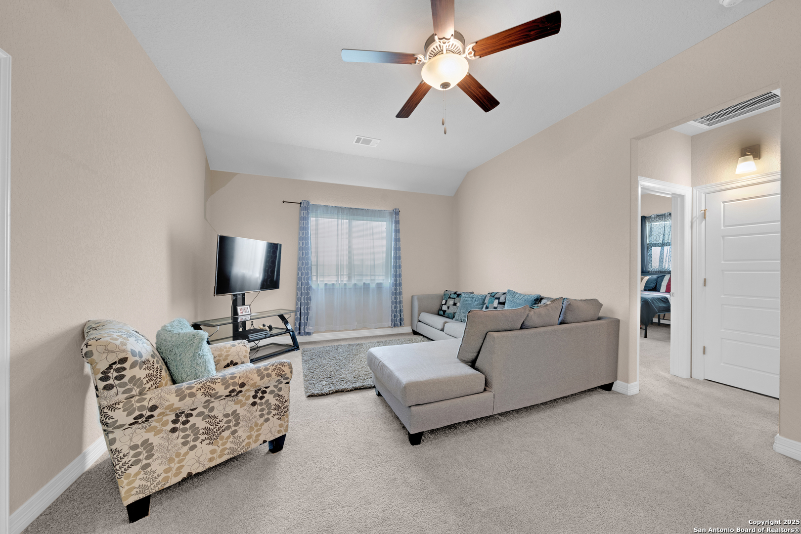 7151 Agarita Mist Fair Oaks Ranch, TX 78015 - Photo 27 of 49 a living room with furniture and a flat screen tv