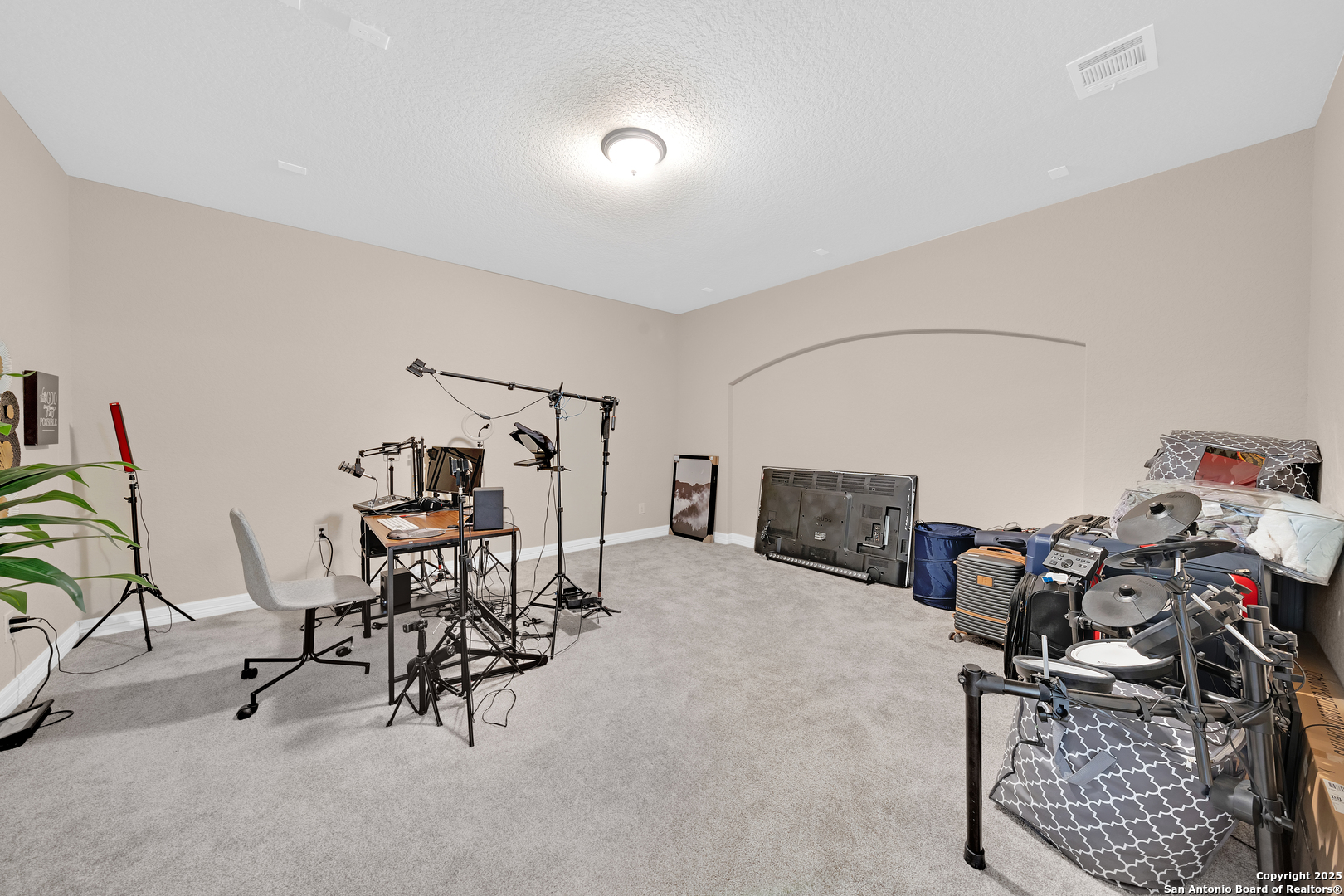 7151 Agarita Mist Fair Oaks Ranch, TX 78015 - Photo 28 of 49 a view of a livingroom with furniture and a potted plant
