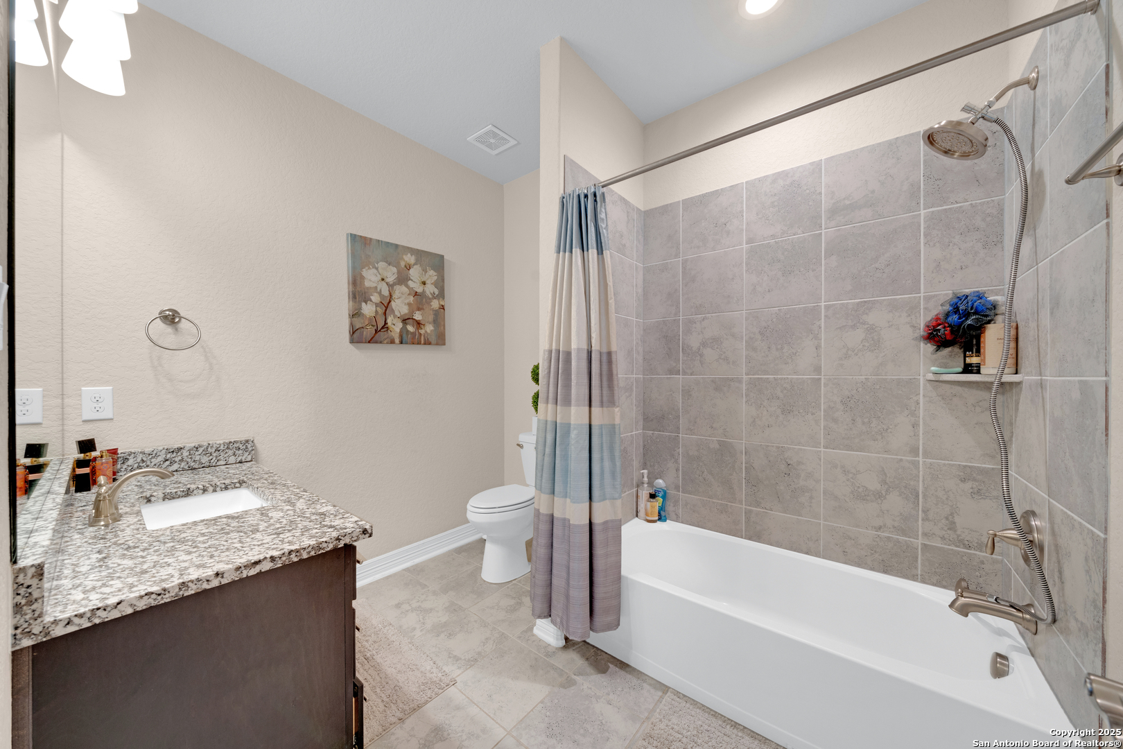 7151 Agarita Mist Fair Oaks Ranch, TX 78015 - Photo 31 of 49 a bathroom with a granite countertop sink a toilet and bathtub