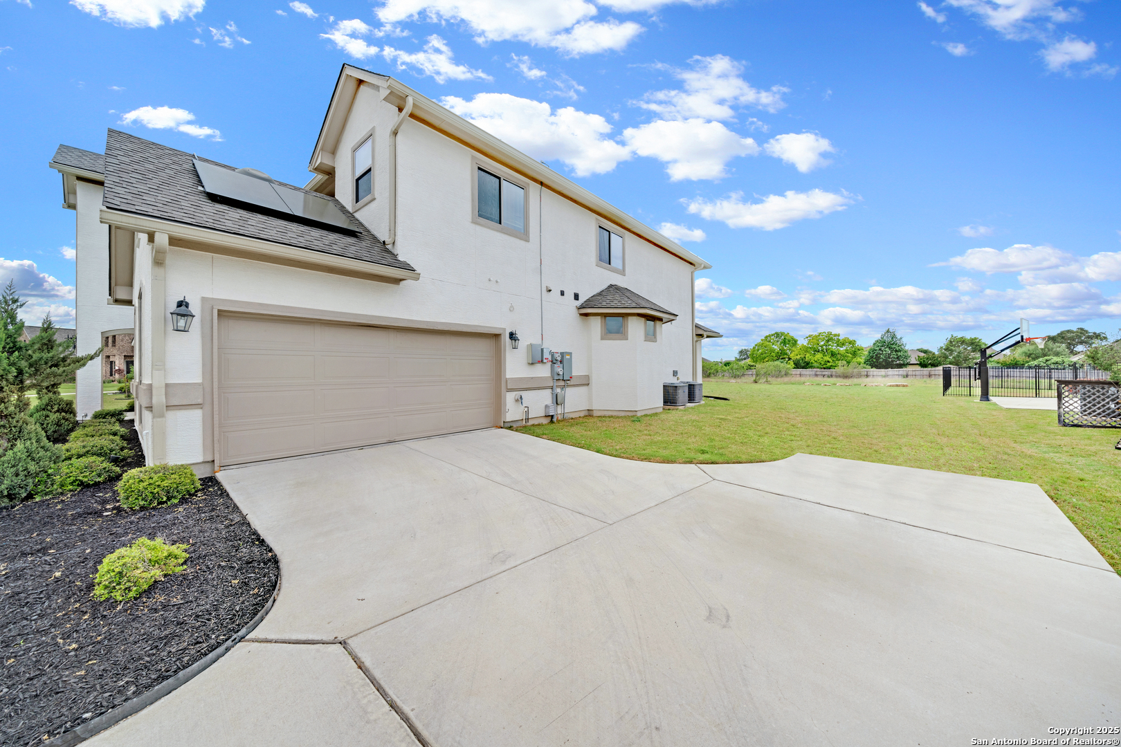 7151 Agarita Mist Fair Oaks Ranch, TX 78015 - Photo 39 of 49 a view of a house with a yard