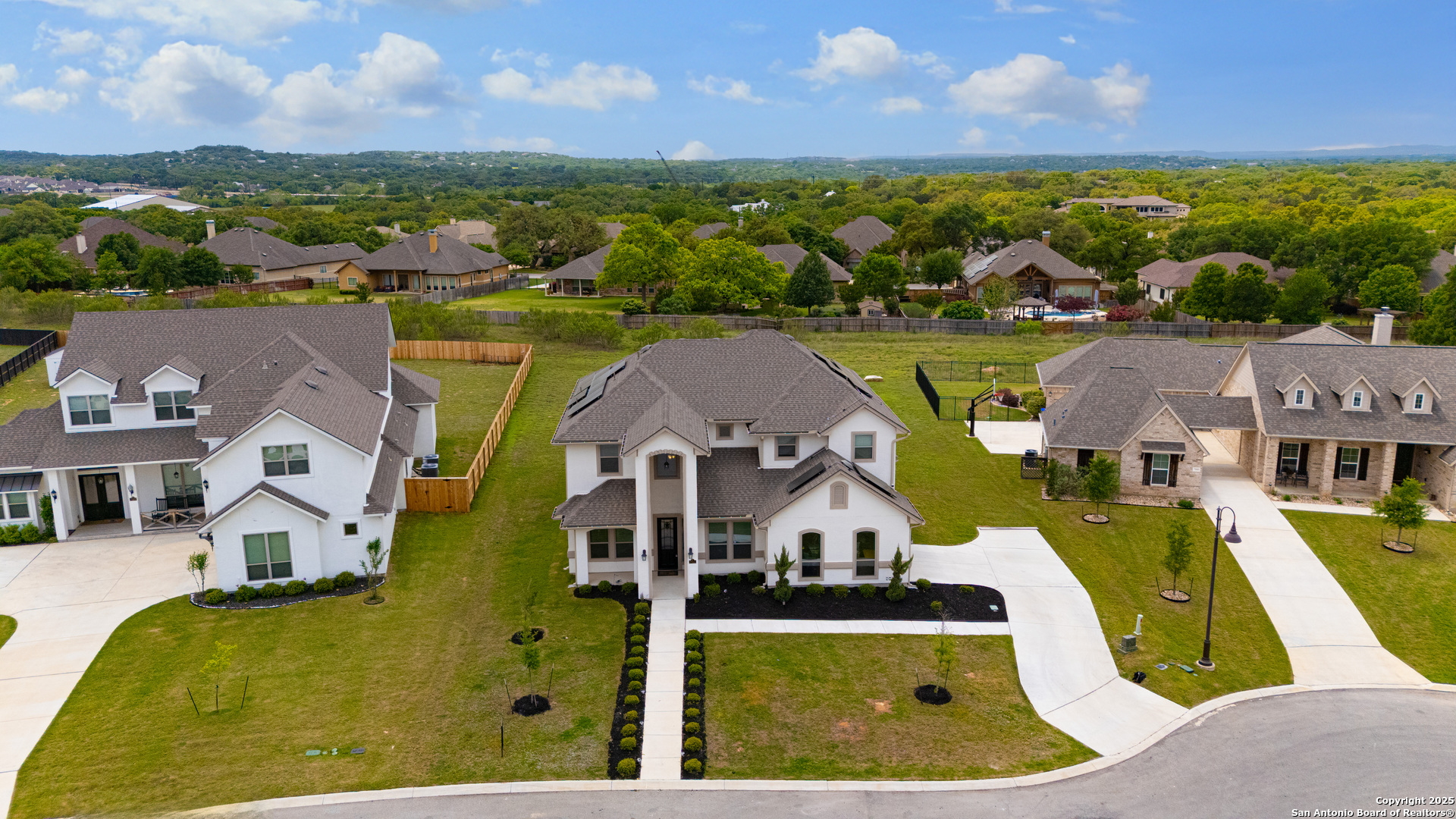 7151 Agarita Mist Fair Oaks Ranch, TX 78015 - Photo 43 of 49 an aerial view of a house with a swimming pool
