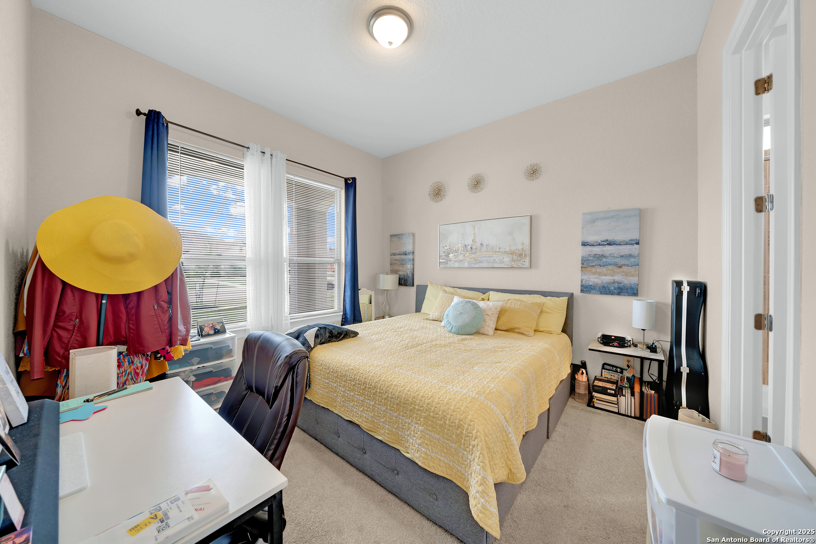 7151 Agarita Mist Fair Oaks Ranch, TX 78015 - Photo 6 of 49 a bedroom with a bed a dresser and a mirror