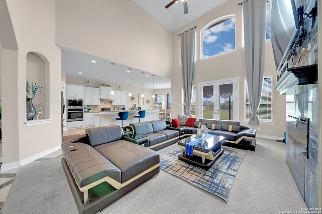 a living room with furniture and a large window