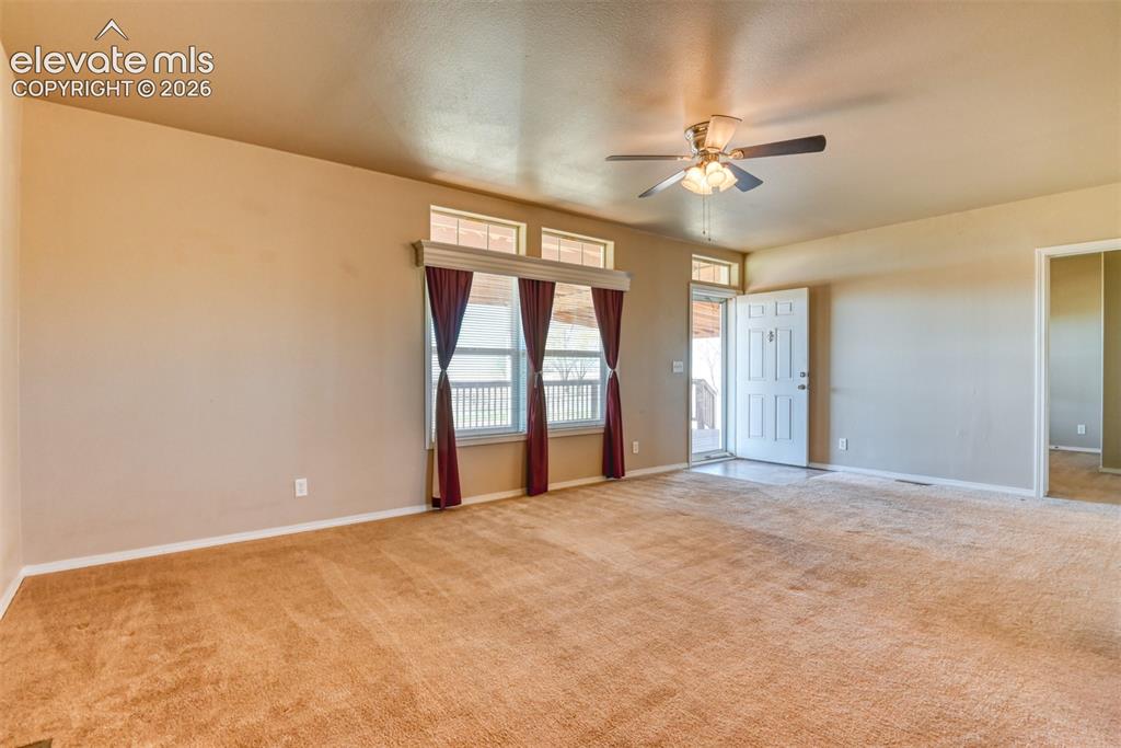 22558 Enoch Road Calhan, CO 80808 - Photo 6 of 50 a view of an empty room with a window