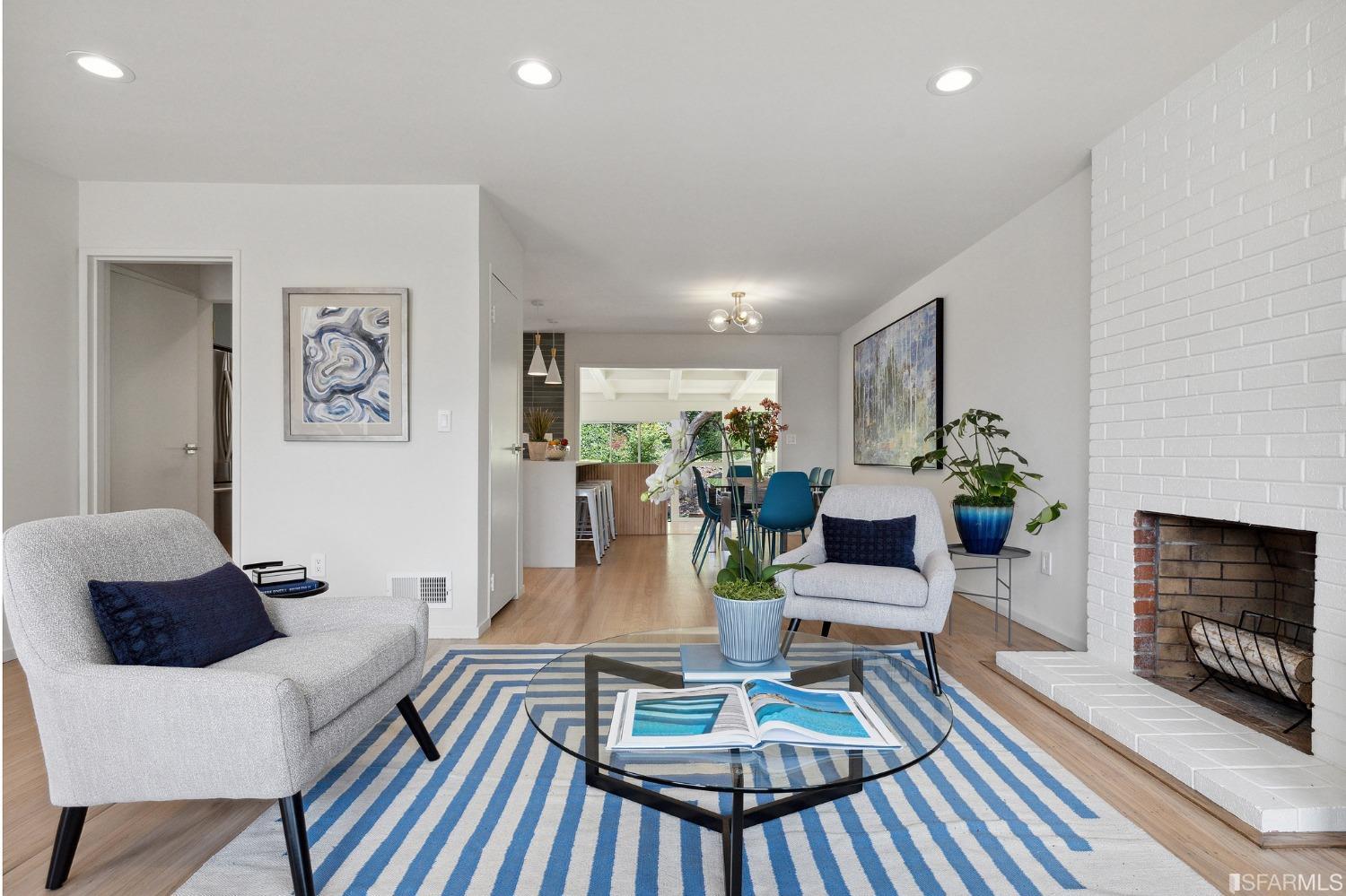 39 Idlewild Court Pacifica, CA 94044 - Photo 11 of 79 a living room with furniture a fireplace and a flat screen tv