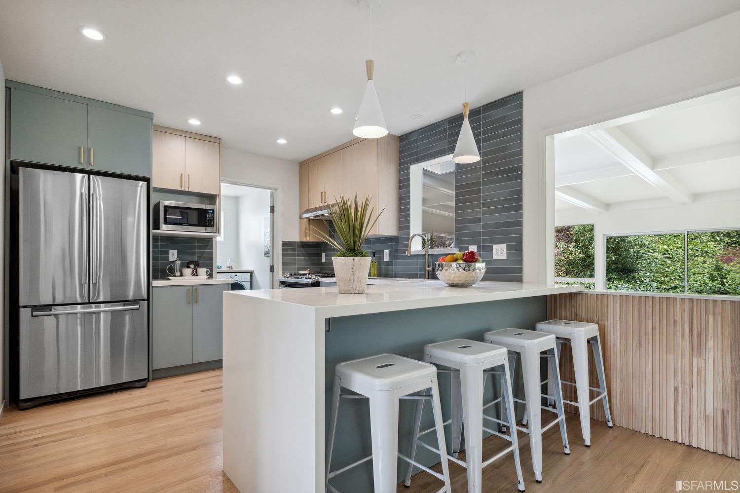 39 Idlewild Court Pacifica, CA 94044 - Photo 17 of 79 a kitchen with wooden floors and refrigerator