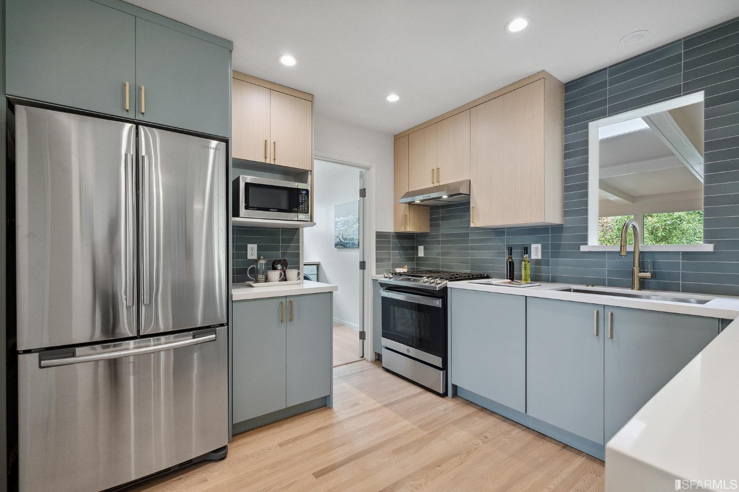 39 Idlewild Court Pacifica, CA 94044 - Photo 18 of 79 a kitchen with stainless steel appliances a refrigerator sink and microwave