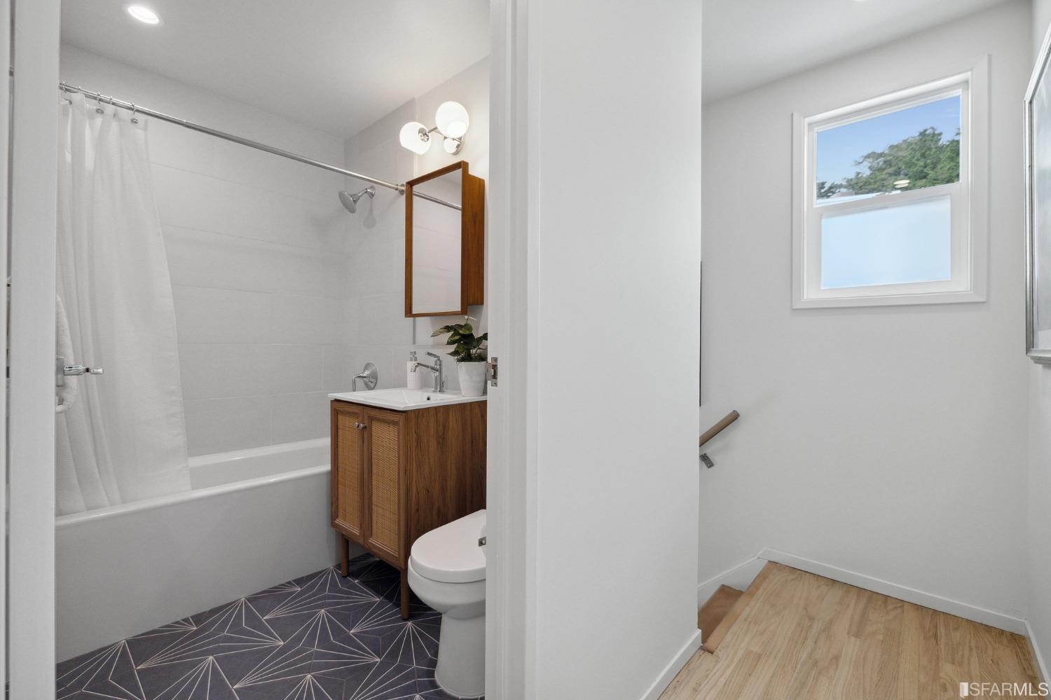 39 Idlewild Court Pacifica, CA 94044 - Photo 37 of 79 a bathroom with a toilet a sink and bathtub
