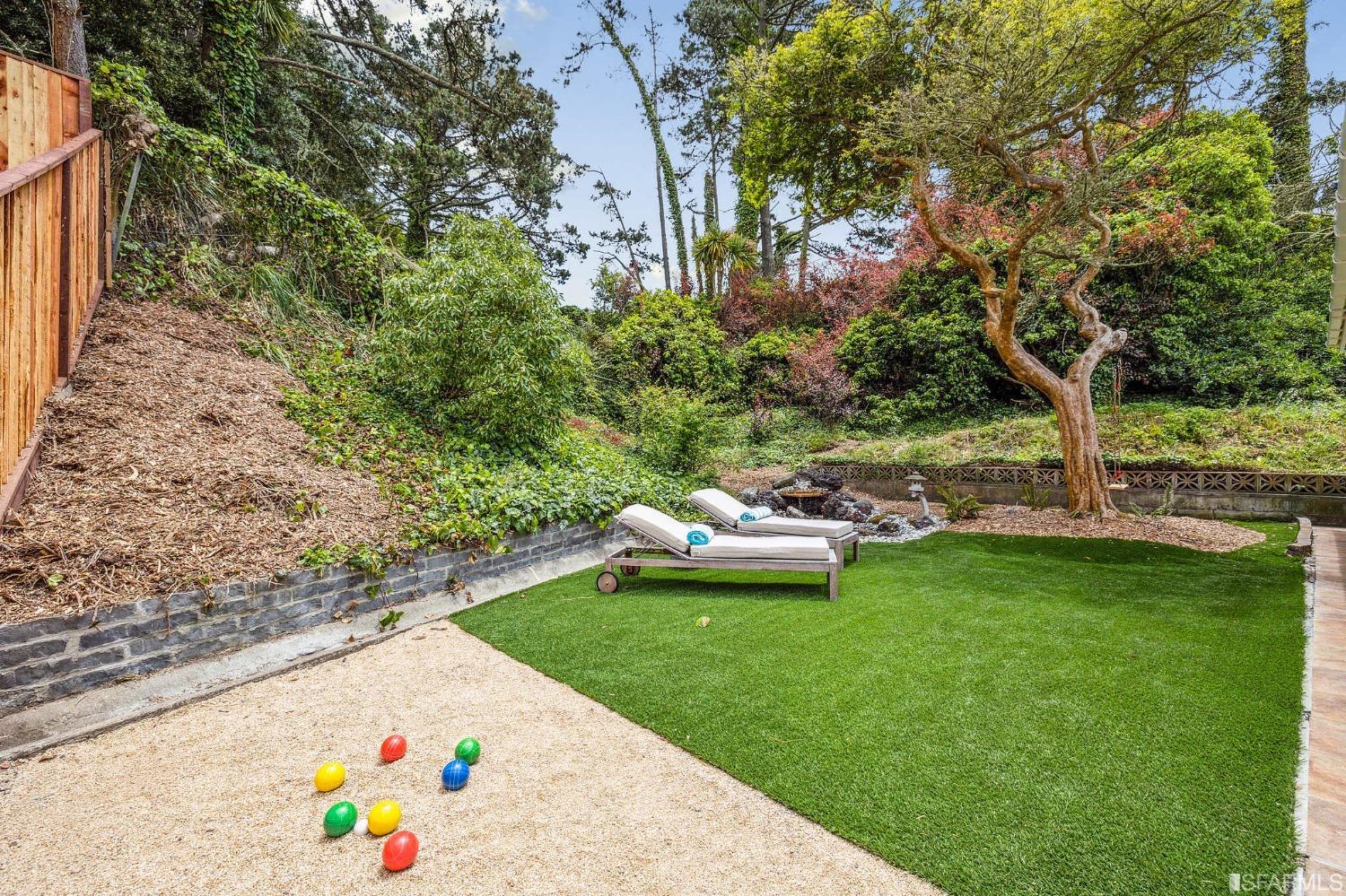 39 Idlewild Court Pacifica, CA 94044 - Photo 47 of 79 a view of a white house with a yard and sitting area