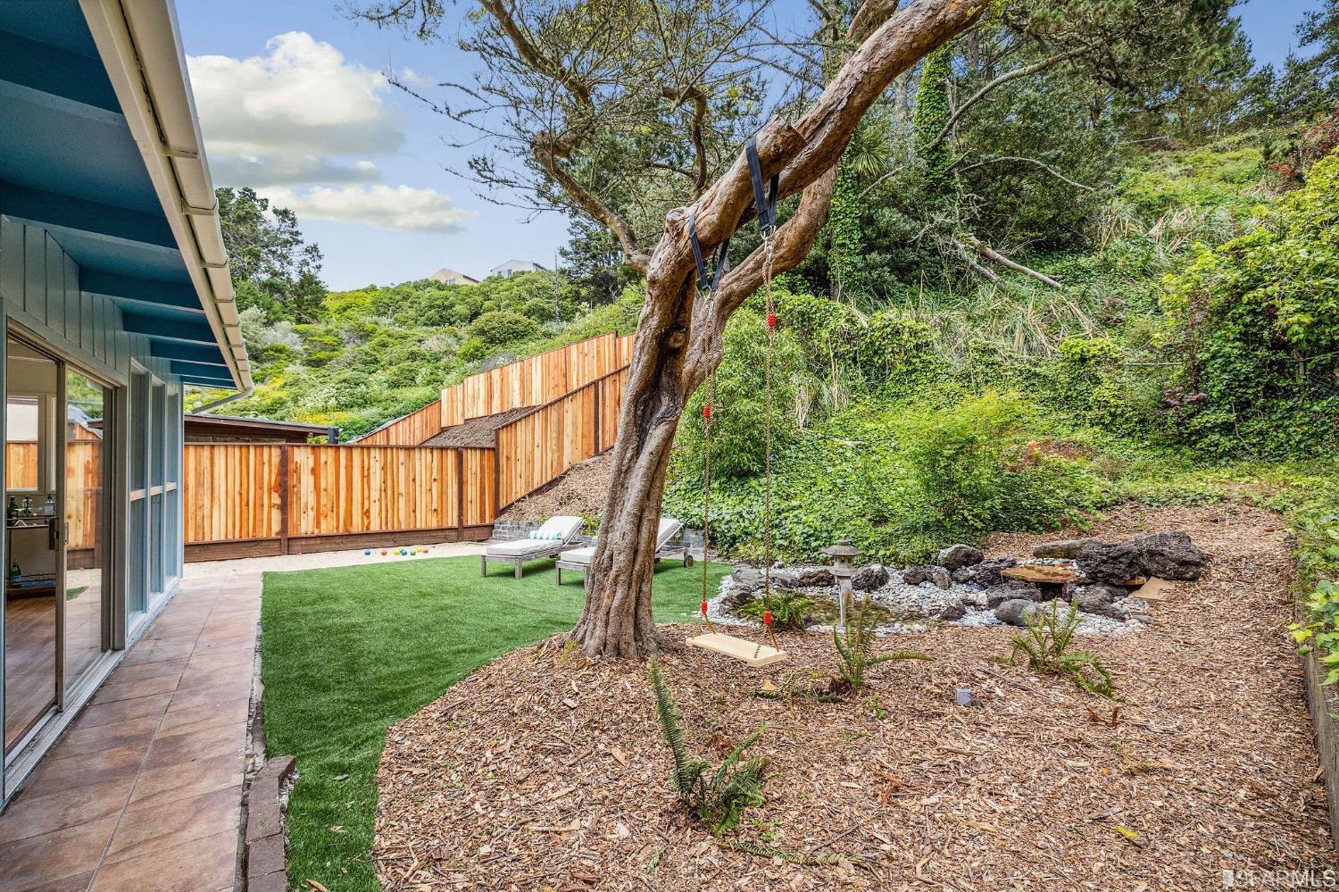 39 Idlewild Court Pacifica, CA 94044 - Photo 52 of 79 a view of a yard with plants and a trees