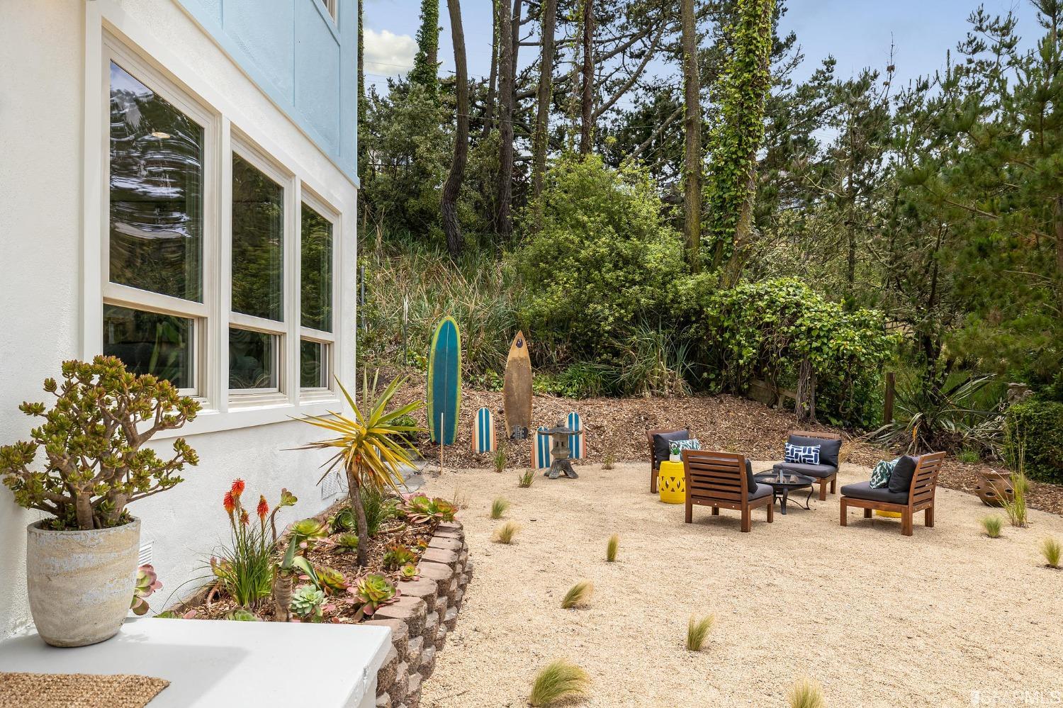 39 Idlewild Court Pacifica, CA 94044 - Photo 62 of 79 a view of a patio with a table and chairs and potted plants