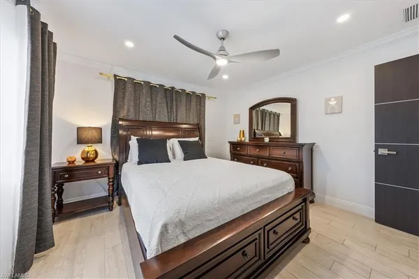 a bed room with a bed and a television