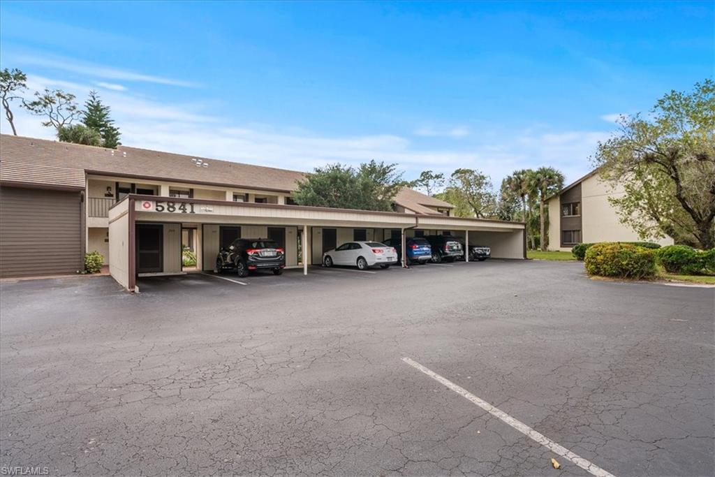 5841 Rattlesnake Hammock Road, Unit 2 Naples, FL 34113 - Photo 2 of 21 a view of a big house with a street