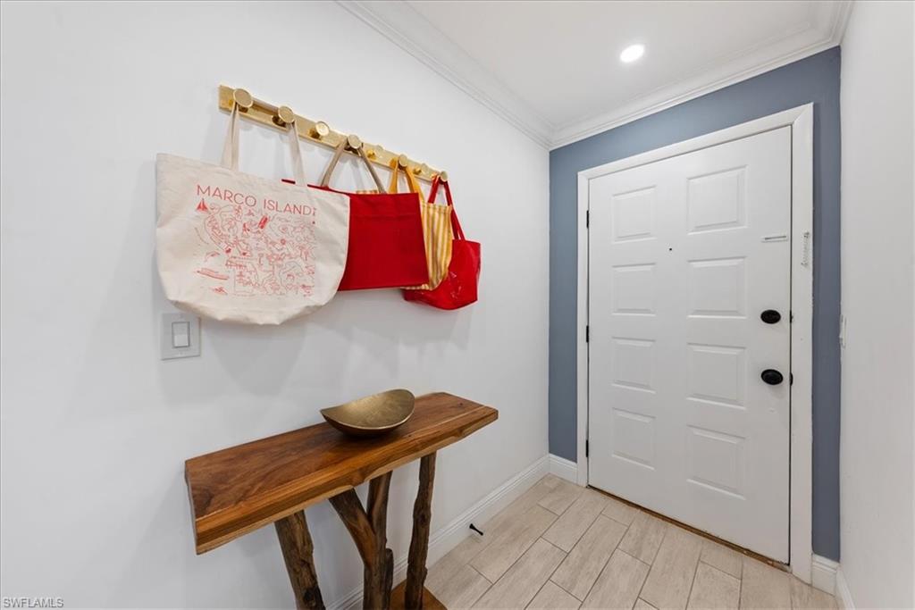 5841 Rattlesnake Hammock Road, Unit 2 Naples, FL 34113 - Photo 5 of 21 a view of a room with shelves and closet