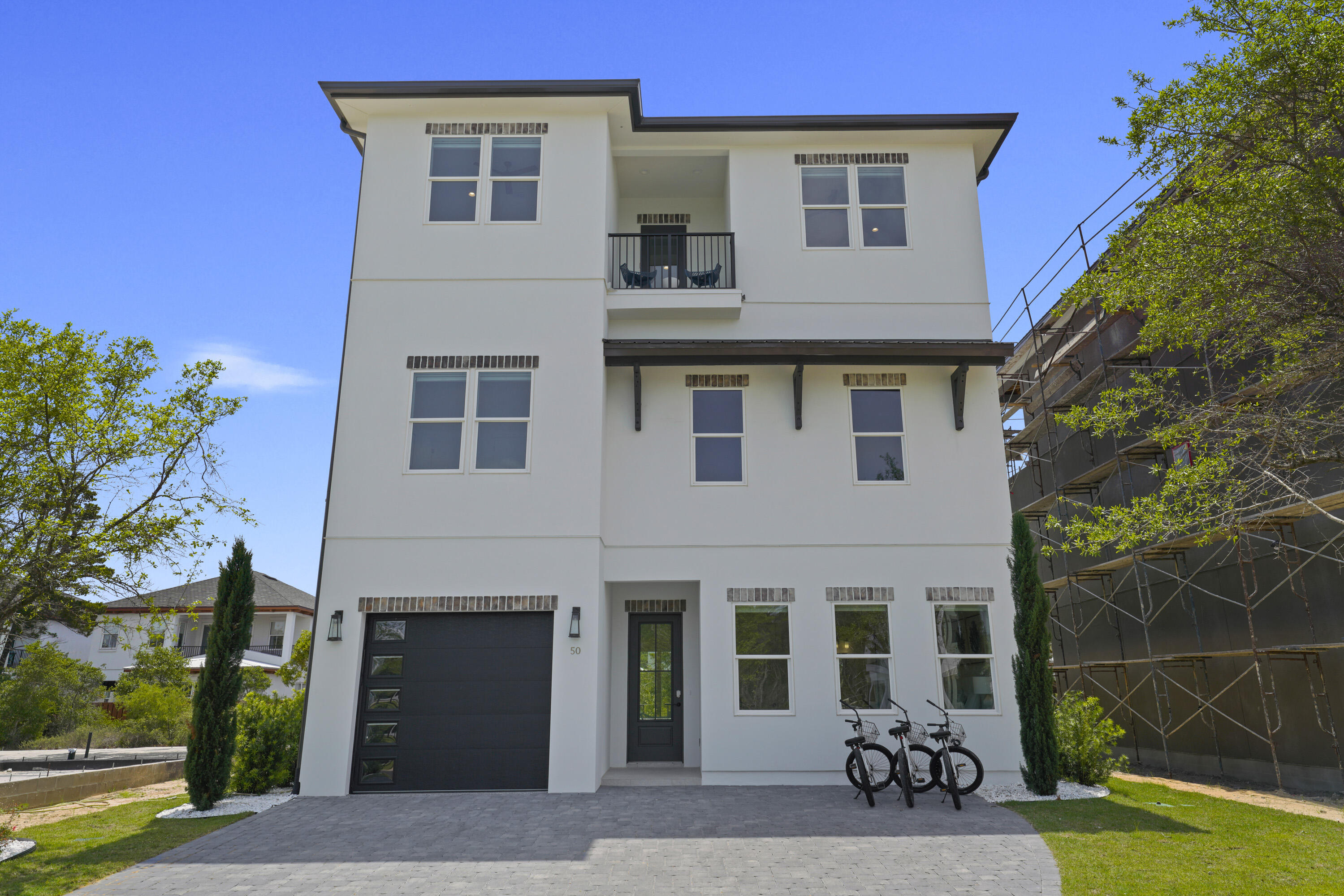 a view of a house with a yard and a porch