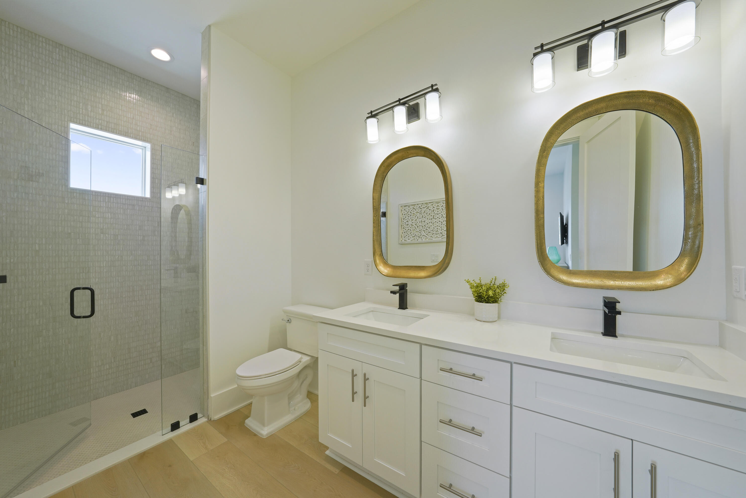 50 Sea Croft Cove Santa Rosa Beach, FL 32459 - Photo 33 of 46 a bathroom with a granite countertop toilet a sink and a mirror