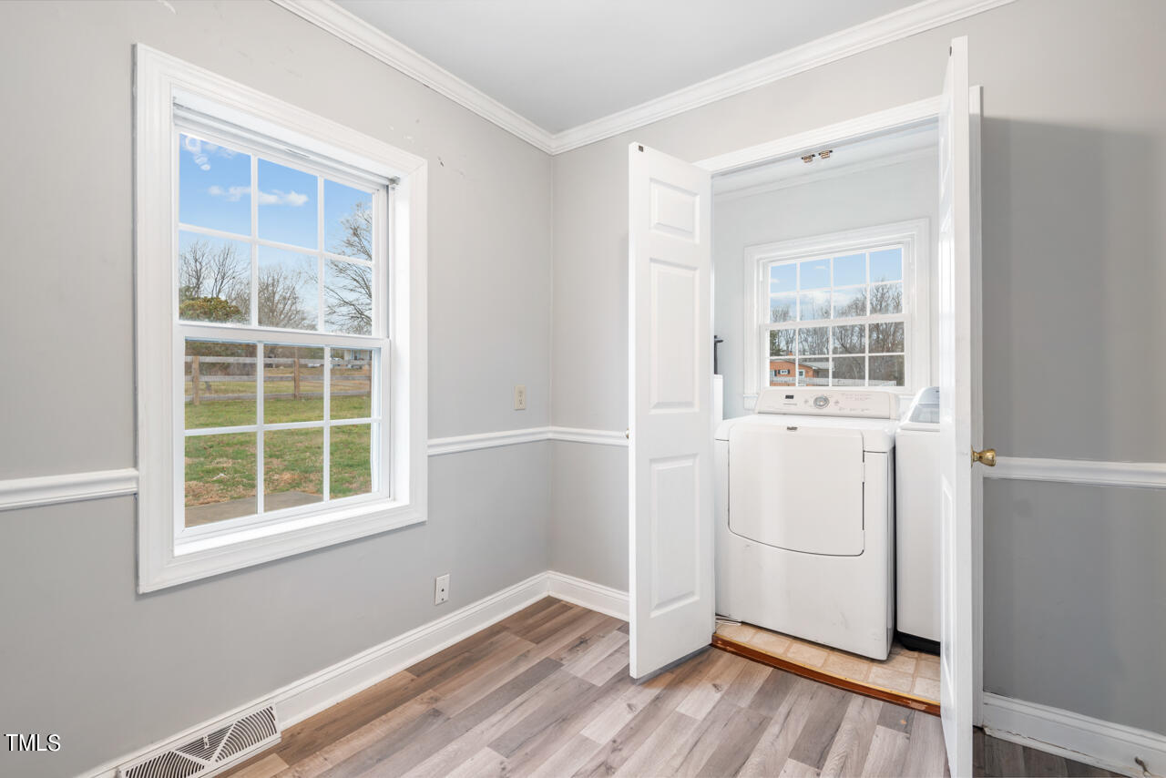 2034 Mt Harmony Church Road Rougemont, NC 27572 - Photo 14 of 40 a view of a room with a wooden floor and windows