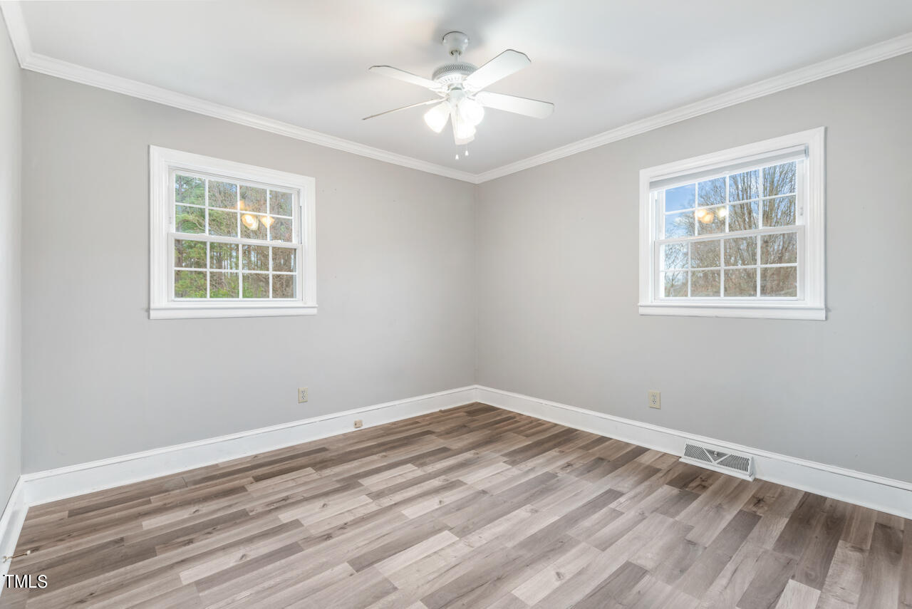 2034 Mt Harmony Church Road Rougemont, NC 27572 - Photo 16 of 40 a view of a room with window and ceiling fan