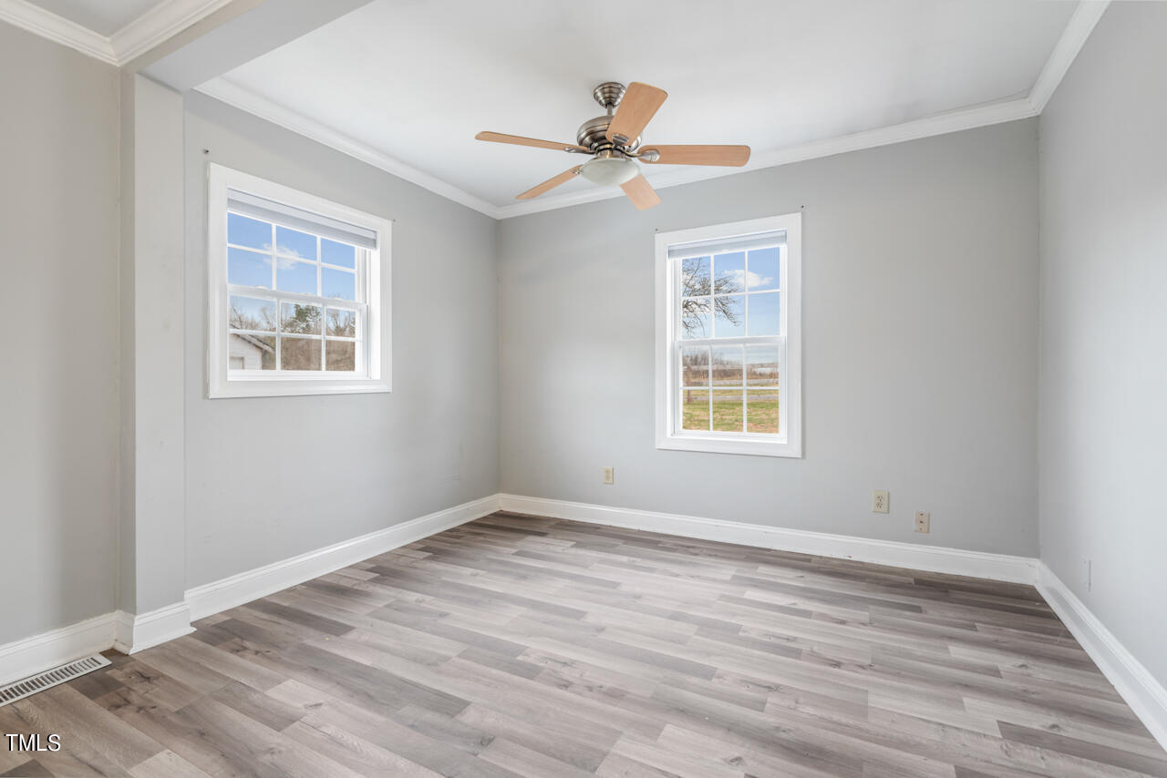 2034 Mt Harmony Church Road Rougemont, NC 27572 - Photo 20 of 40 a view of an empty room with wooden floor and a window