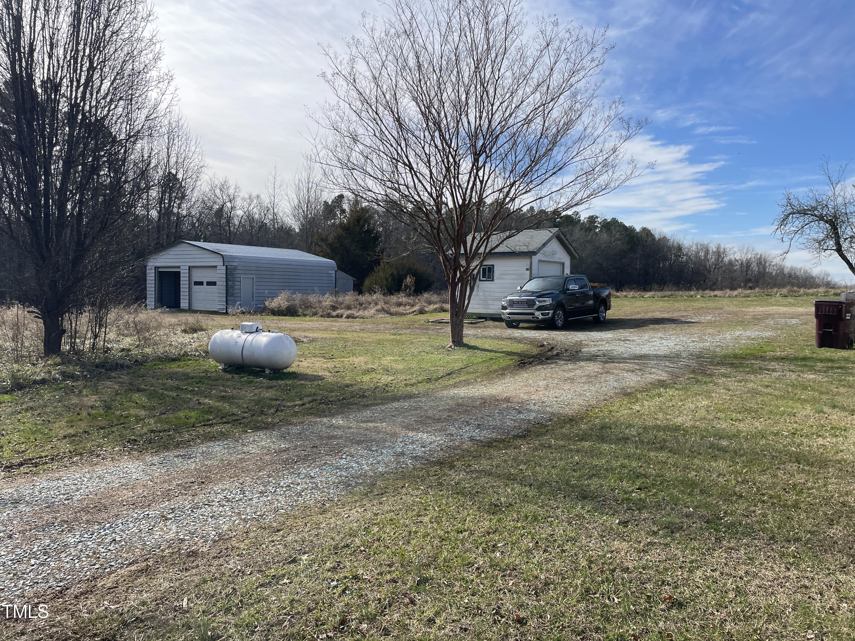 2034 Mt Harmony Church Road Rougemont, NC 27572 - Photo 25 of 40 a view of a house with a yard