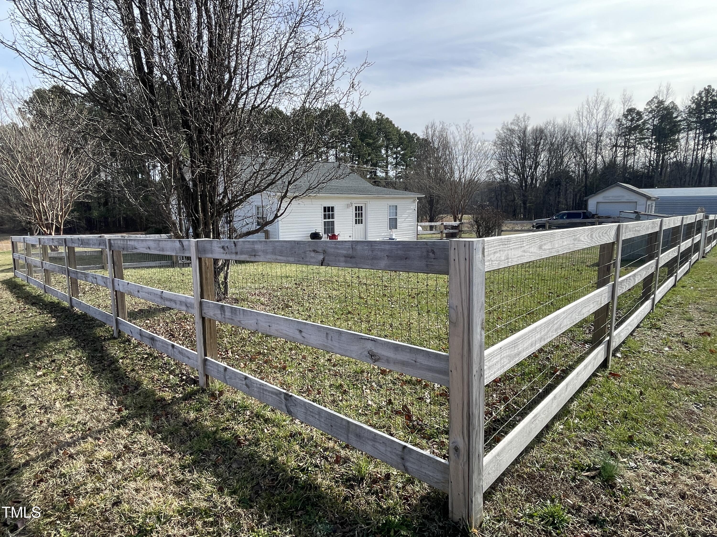 2034 Mt Harmony Church Road Rougemont, NC 27572 - Photo 29 of 40 a view of a house with wooden fence and a backyard