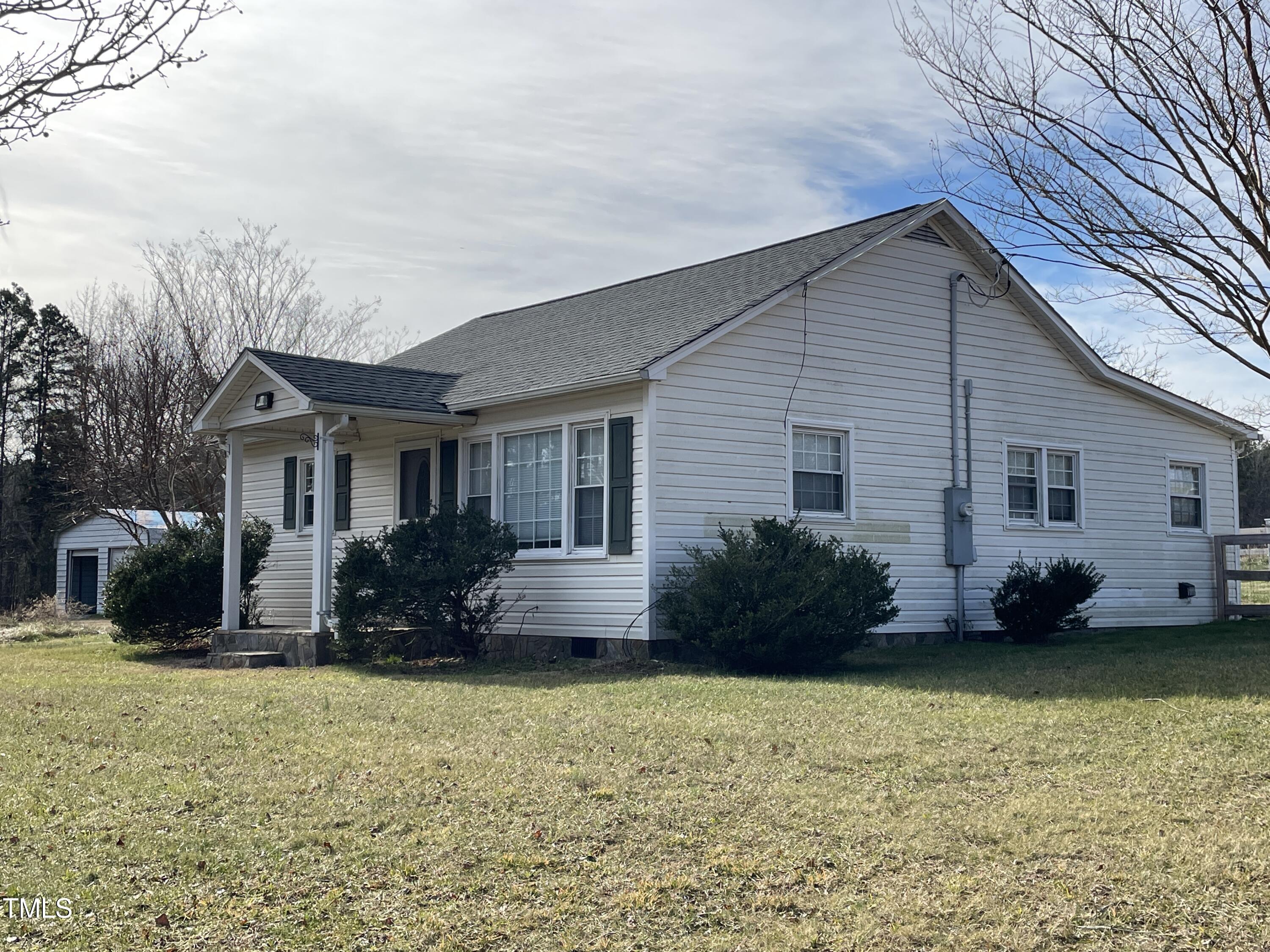 2034 Mt Harmony Church Road Rougemont, NC 27572 - Photo 32 of 40 a front view of a house with a garden