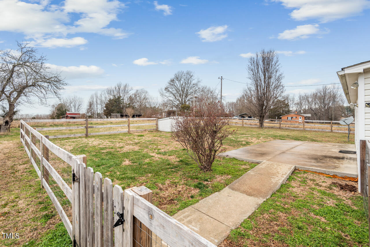 2034 Mt Harmony Church Road Rougemont, NC 27572 - Photo 38 of 40 a view of a swimming pool with a patio and a yard