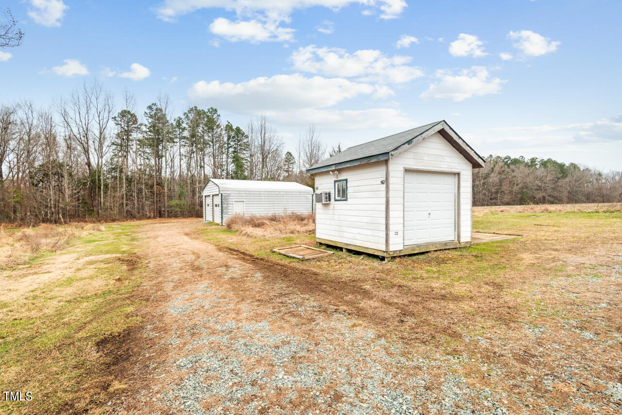 2034 Mt Harmony Church Road Rougemont, NC 27572 - Photo 39 of 40 a view of a house with a yard
