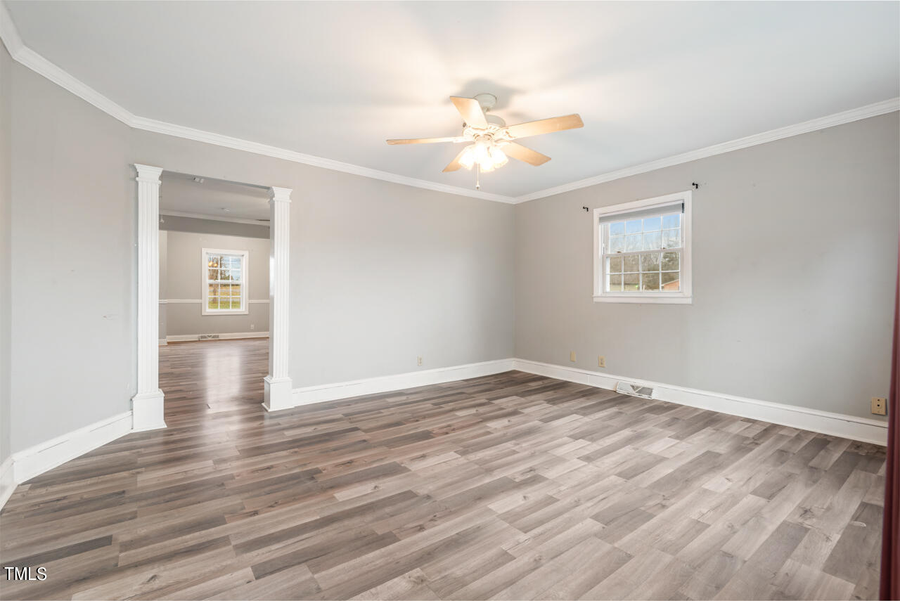 2034 Mt Harmony Church Road Rougemont, NC 27572 - Photo 6 of 40 a view of an empty room with wooden floor and a window