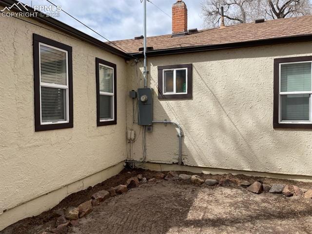 811 Prairie Road Colorado Springs, CO 80909 - Photo 28 of 28 Back of house by replaced electrical panel