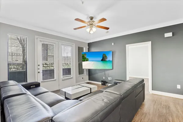 a living room with furniture and a window