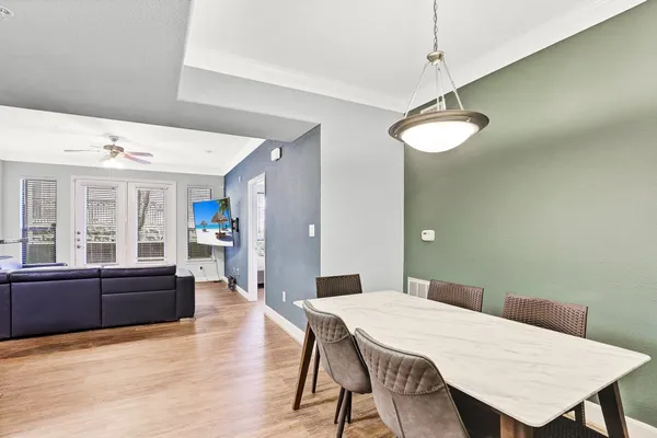 a view of a dining room with furniture window and wooden floor