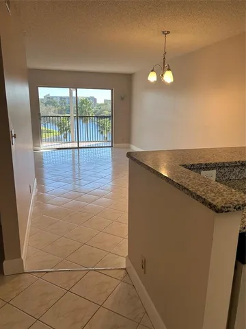 a view of a kitchen from a dining room