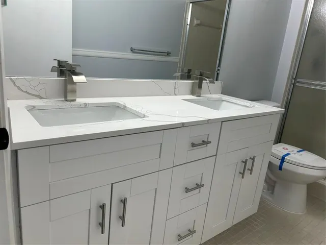 a bathroom with a sink and a toilet
