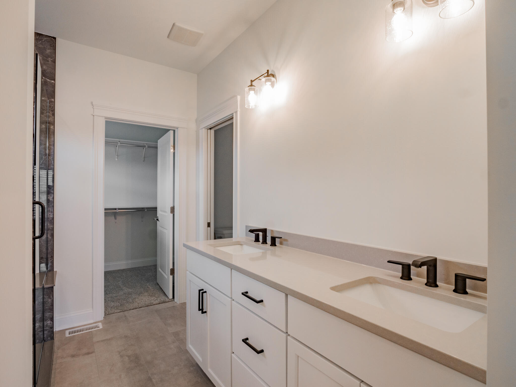 7522 East 116th Avenue Crown Point, IN 46307 - Photo 19 of 23 a bathroom with a double vanity sink and a mirror