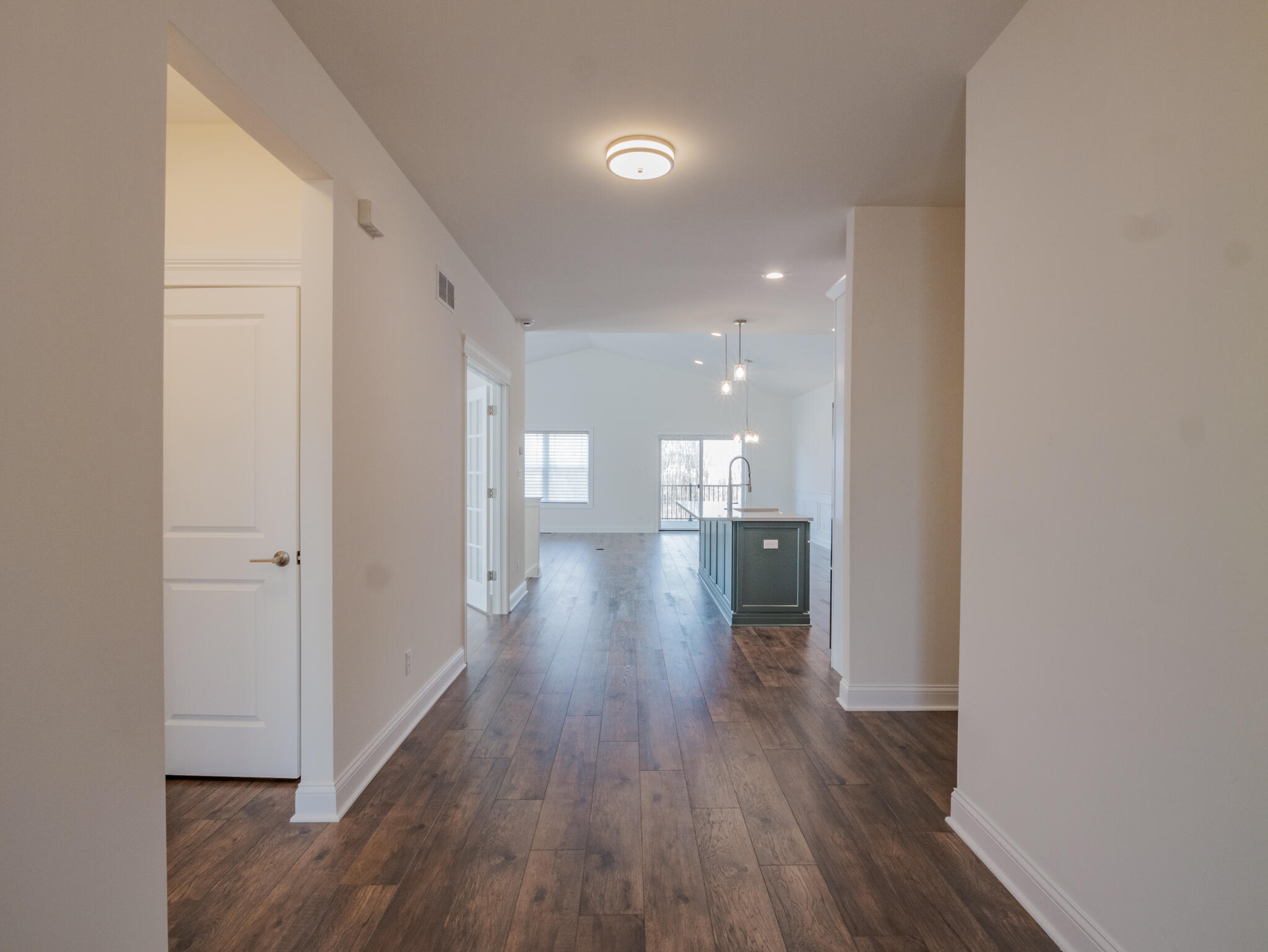 7522 East 116th Avenue Crown Point, IN 46307 - Photo 2 of 23 a view of a hallway with wooden floor