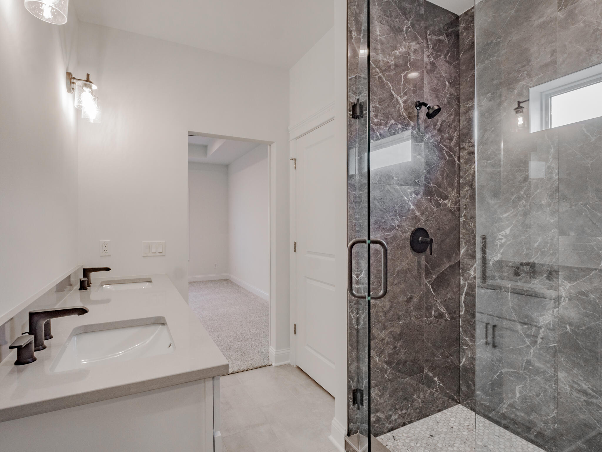 7522 East 116th Avenue Crown Point, IN 46307 - Photo 21 of 23 a bathroom with a sink and shower