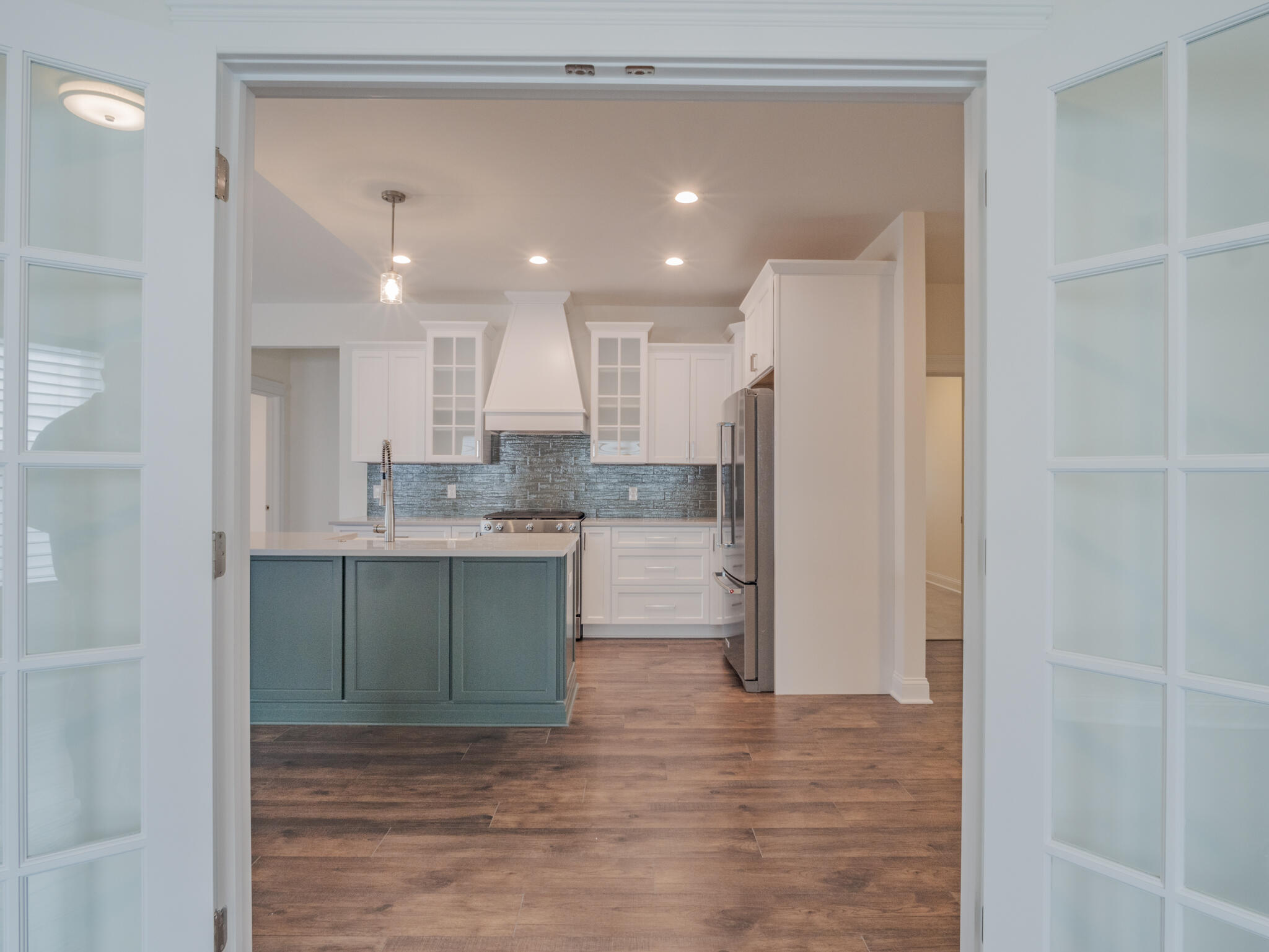 7522 East 116th Avenue Crown Point, IN 46307 - Photo 10 of 23 a kitchen with kitchen island a sink stainless steel appliances and cabinets