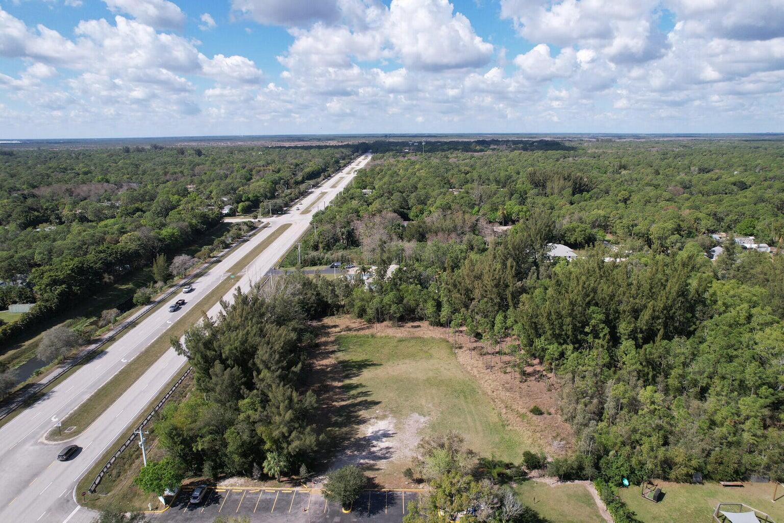Xxxxx East Indiantown Road Jupiter, FL 33458 - Photo 15 of 24 a view of a city with lush green forest