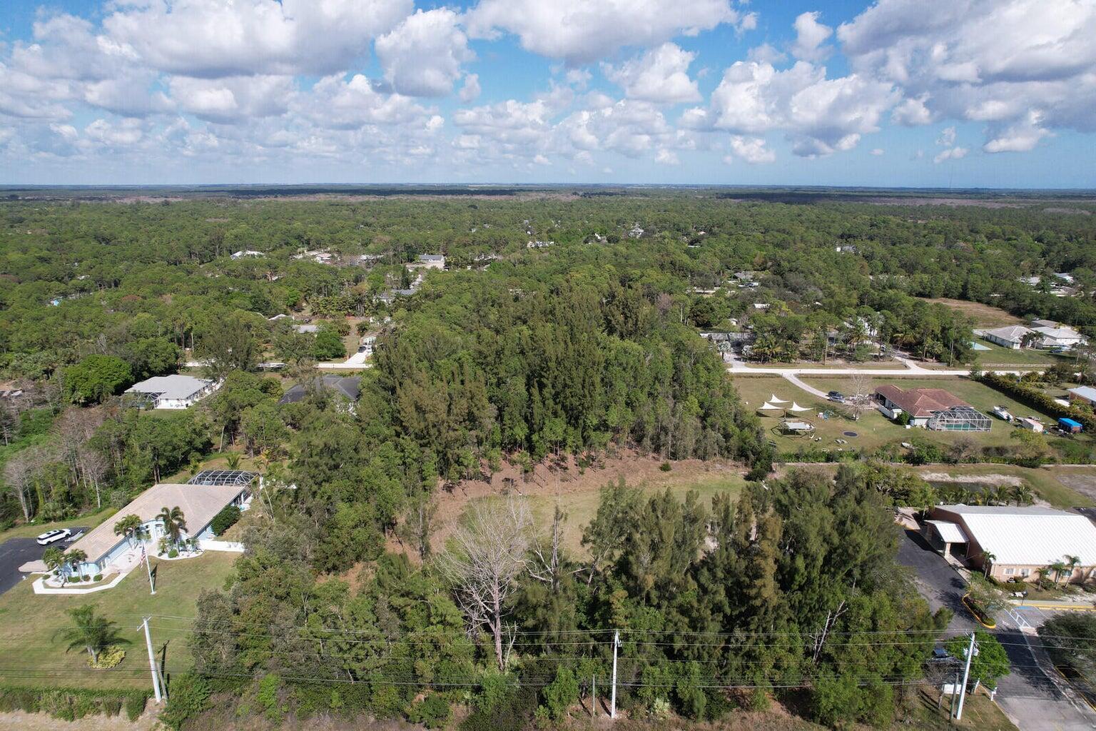 Xxxxx East Indiantown Road Jupiter, FL 33458 - Photo 22 of 24 an aerial view of residential houses with outdoor space and trees