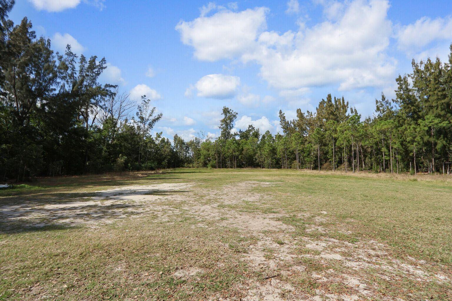 Xxxxx East Indiantown Road Jupiter, FL 33458 - Photo 4 of 24 a view of a field with trees