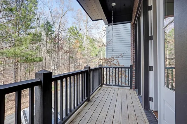 a view of a balcony with wooden floor